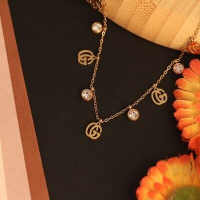 Stylish Gold-Tone Charm Necklace with Crystal Elegance